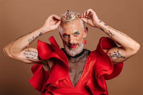 Premium Photo Portrait Of Confident Mature Gay Man In Beautiful Red Dress Wearing Crown