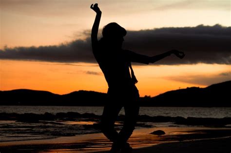 Premium Photo Silhouette Woman Standing At Beach During Sunset