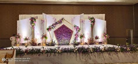 Elaborate Wedding Stage Decor with Flowers and Greenery