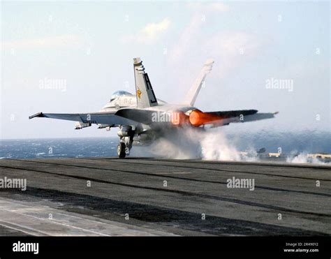 US Navy An F A 18 Hornet Launches From One Of Four Steam Powered