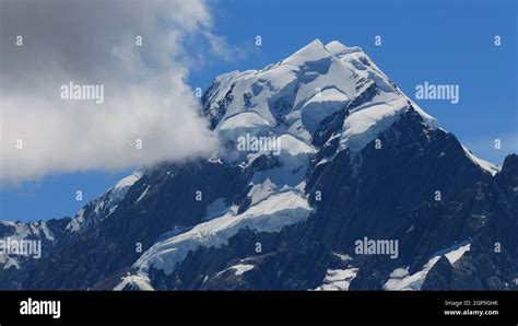 Glacier on top of Mount Cook and cloud Stock Photo - Alamy