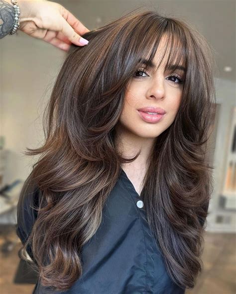 Long Thick Brunette Hair With Wispy Bangs And Layers Haircuts For Long