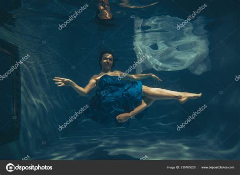 Cute Sporty Female Swims Underwater Free Diver Blue Evening Dress Stock