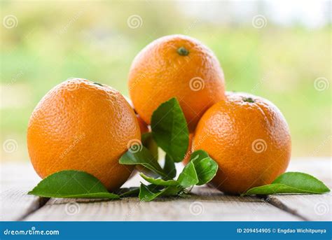 Orange Fruits With Leaf On Wooden And Nature Background Fresh Orange