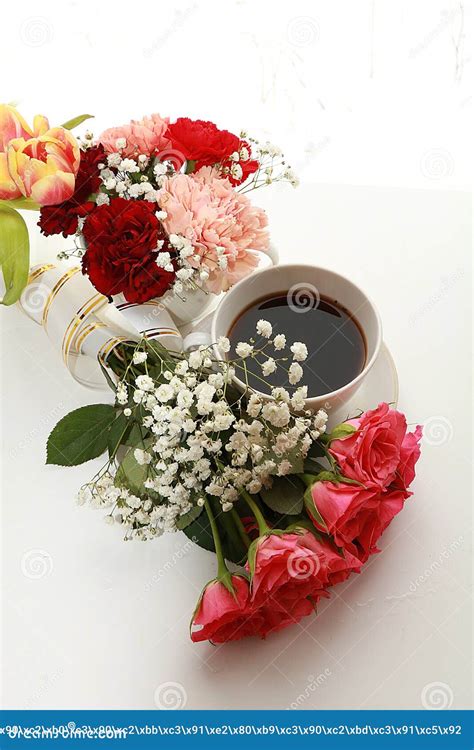 Cup Of Coffee And A Bouquet Of Flowers On A White Background Stock