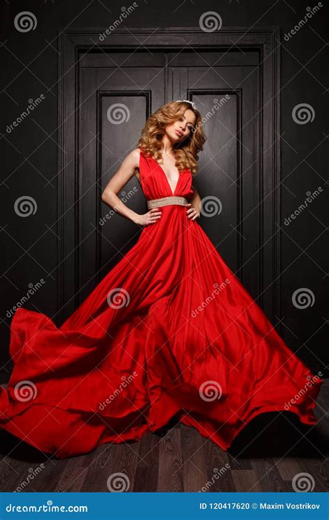 Beautiful Smart Dressed Woman In The Red Evening Fluttering Dress Is