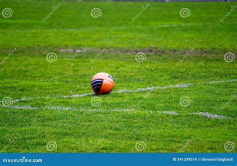 Traditional Orange Soccer Ball on Soccer Field Stock Photo - Image of grass, line: 241339576