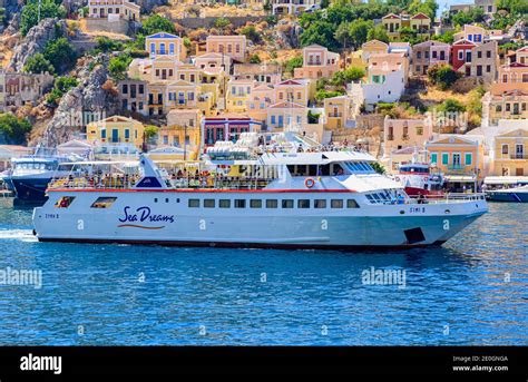 Simi II day trip ferry leaving the port of Gialos, Symi Island ...