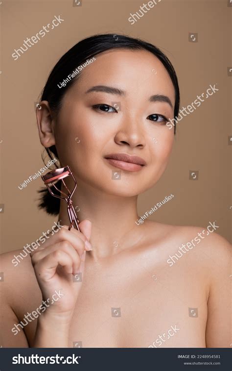 Pretty Asian Woman Naked Shoulders Holding Stock Photo