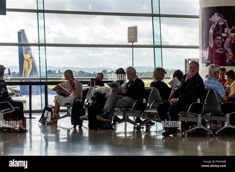 Dublin Airport Ireland Passengers Wait To Board A Flight Sit At