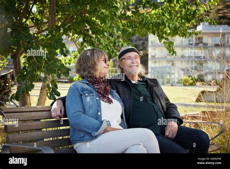 Mature Couple Relaxing On Bench Stock Photo Alamy