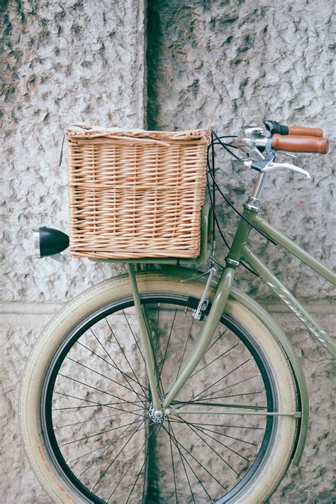 Vintage bicycle with basket near wall · Free Stock Photo