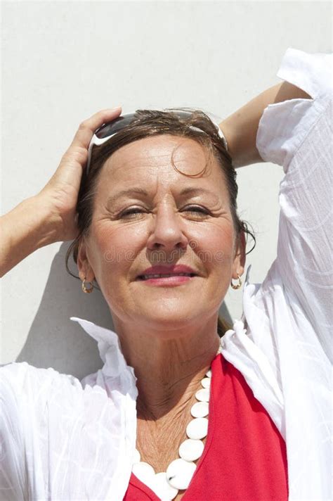 Mature Woman Relaxing On Sunny Day Stock Photo Image Of Pillars