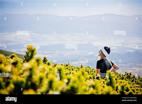 Beautiful Blonde Woman Enjoys The Moment On A Mountain Hike In The Slovak Tatra Mountains Stock