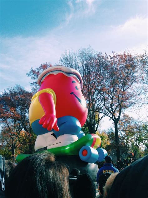 A Large Inflatable Toy Sitting On Top Of A Group Of People