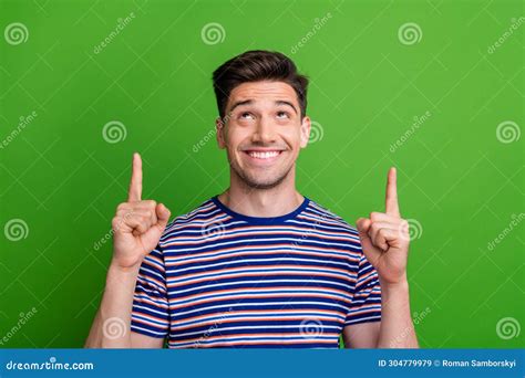 Portrait Of Toothy Beaming Positive Man Wear Stylish T Shirt Look Indicating At Offer Empty