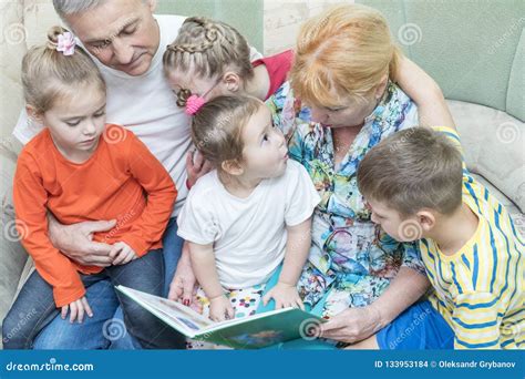 Grandparents Teach Grandchildren To Read Stock Photo Image Of