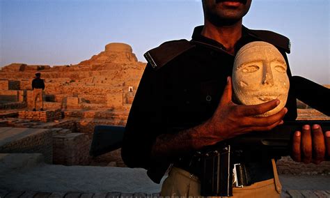 Guard At Mohenjo Daro Archaeology Site With Artifact Pakistan