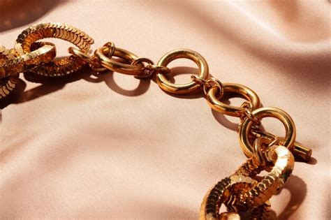 Premium Photo Golden Chain Necklace On Silk Background Close Up