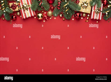 Christmas Ornament Border On Red Background With Copy Space Stock Photo