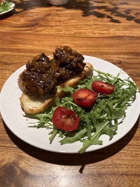 Goose Livers Fried With Apple And Onion On Butter Seared Challah
