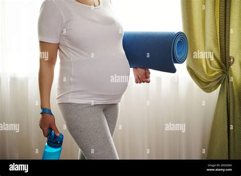 Belly Of Pregnant Woman In Late Pregnancy In White Mockup T Shirt