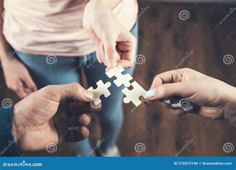 A Group Of Business People Assembling Puzzle Stock Photo Image Of