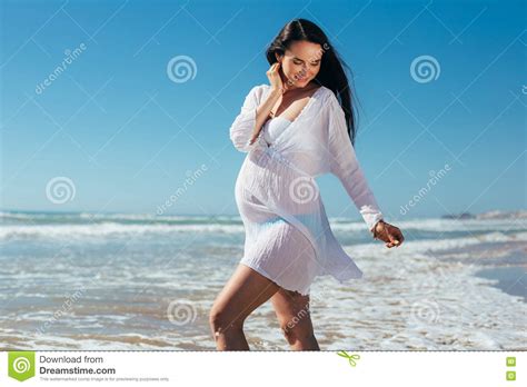 Young Happy Pregnant Woman Relaxing And Enjoying Life In Nature Stock