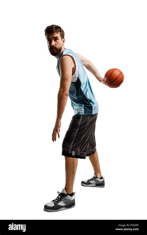 Basketball player holding a ball Stock Photo - Alamy