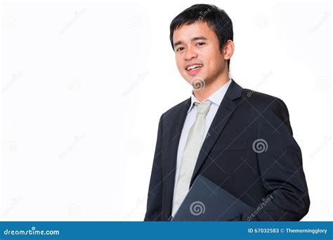 Young Handsome Man Hold Laptop In Black Suit Smiling Stock Image