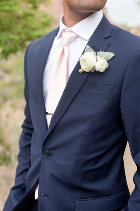 Groom In Navy Suit With Blush Tie And White Boutonniere Wedding