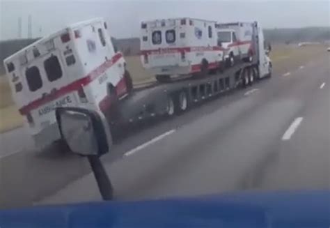 Ambulance Falls Off Of Transport Trailer Rolls Down Interstate