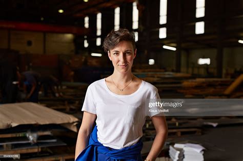 Portrait Of Female Steel Worker Inside Factory High Res Stock Photo