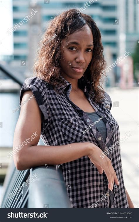 Portrait Mature Black Woman Leaning Against Stock Photo