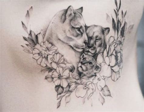 A Woman S Stomach With Two Cats And Flowers On It