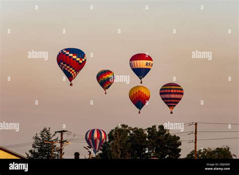 A View Of Multiple Multi Colored Hot Air Balloons Floating In A