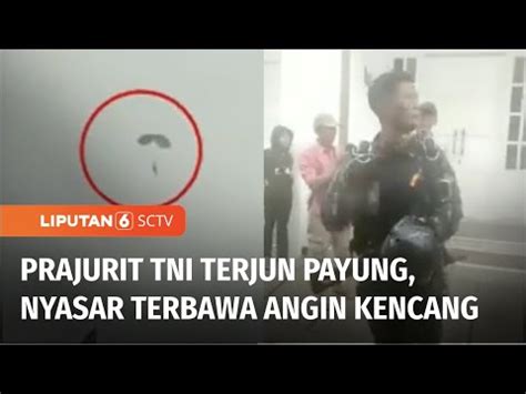 Penerjun Payung TNI Tersangkut Di Atas Pohon Saat Berusaha Mendarat