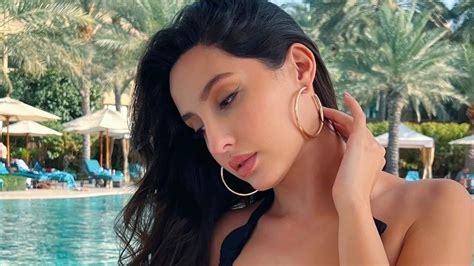 Nora Fatehi Slips Into A Black Bikini Top And Poses By A Pool In A Sexy Throwback Pic Movies