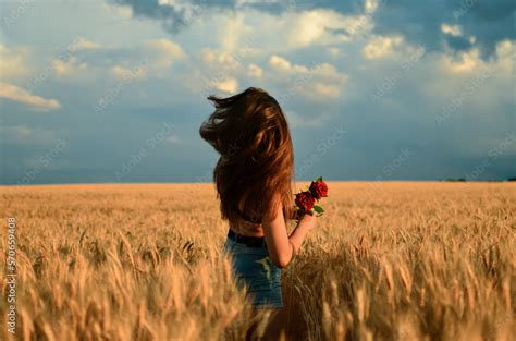Girl With A Naked Back In The Field Blue Sky And Yellow Field Beautiful