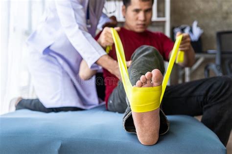 Male Chiropractor Physiotherapist Or Orthopedist Examining A Patient