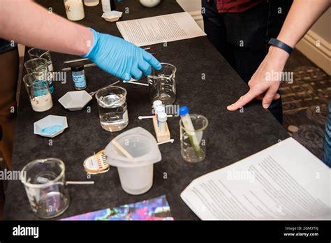 Science Experiment Materials Including Colorful Liquid Filled Beakers