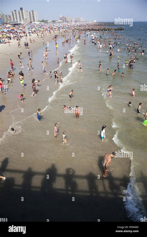 Thousands Of People Enjoy The Beach And Water Along The Atlantic Ocean