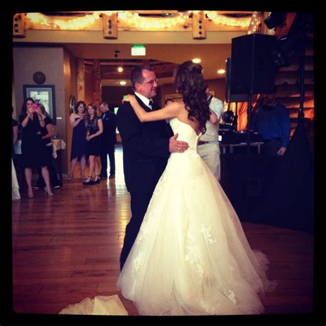 A Bride And Groom Sharing Their First Dance