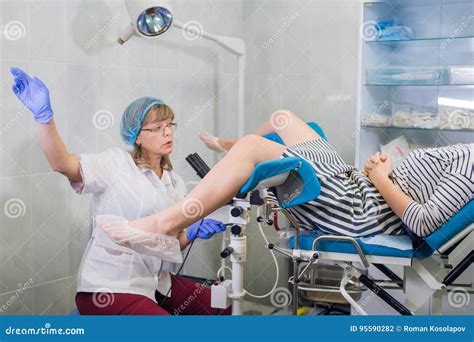 Female Gynecologist During Examination In Her Office Stock Photo