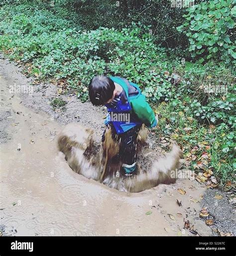 Puddle jumping Stock Photo - Alamy