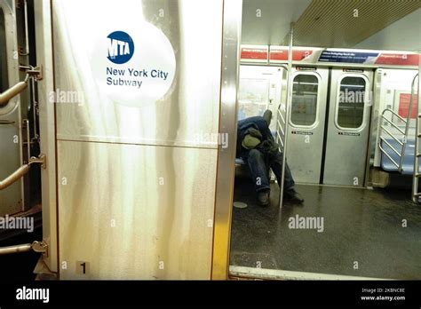 A View Of A Homeless Person Sleeping On A Subway Train In Hudson Yards