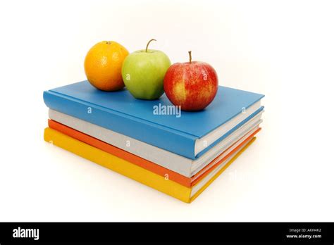 books and apple on an isolated white background Stock Photo - Alamy