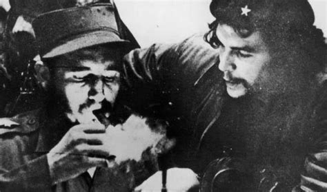 Fidel Castro Lights His Cigar While Che Guevara Looks On In The Early Days Of Their Guerrilla