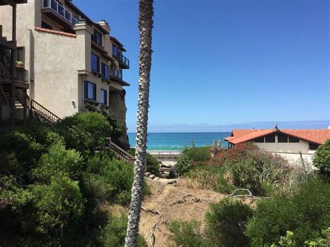 A View Of The Ocean From An Apartment Complex