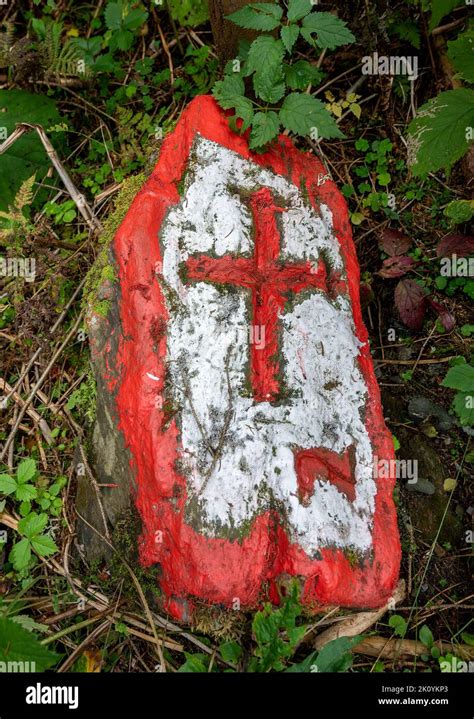 Border Stone With Red Cross On White Background Lying In The